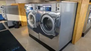 a washing machine in a room - Co-op unattended Laundromat Large Washers